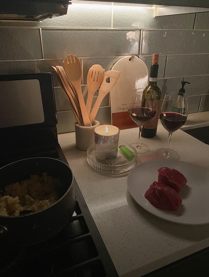 kitchen counter with candle and utensils