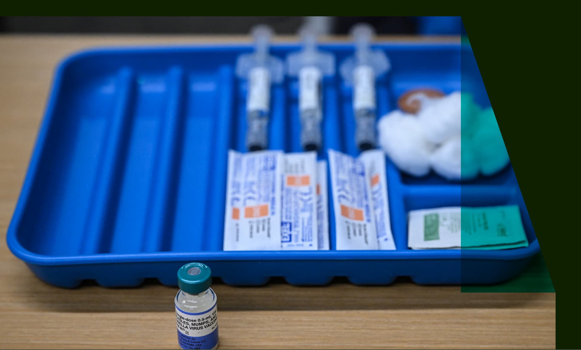 A dose of the measles vaccine is seen on a table at a health center.