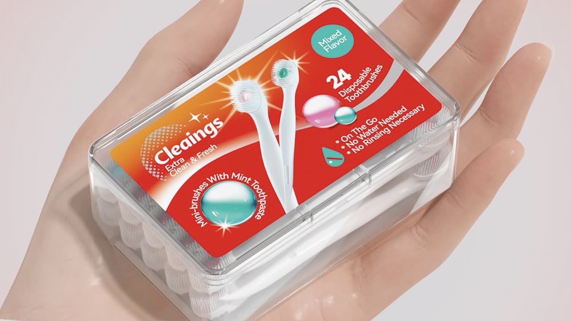 A pack of mini disposable toothbrushes with toothpaste. 
