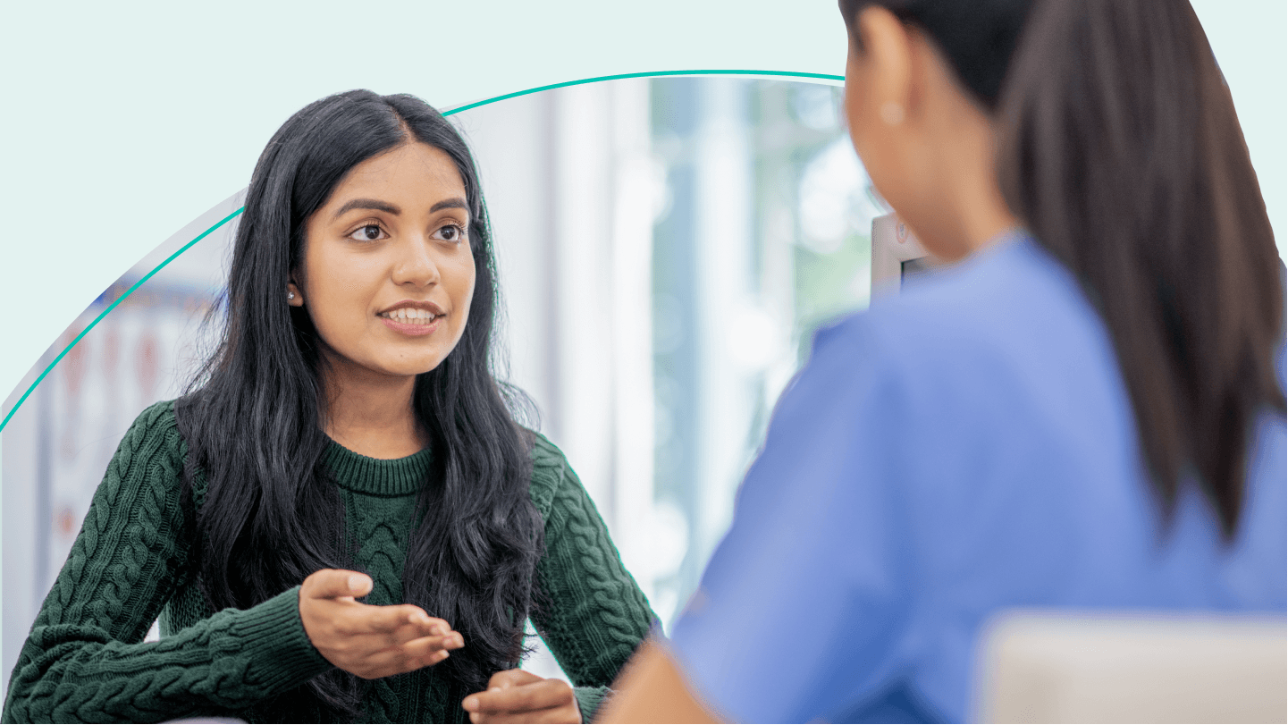 Woman has conversation with her doctor.