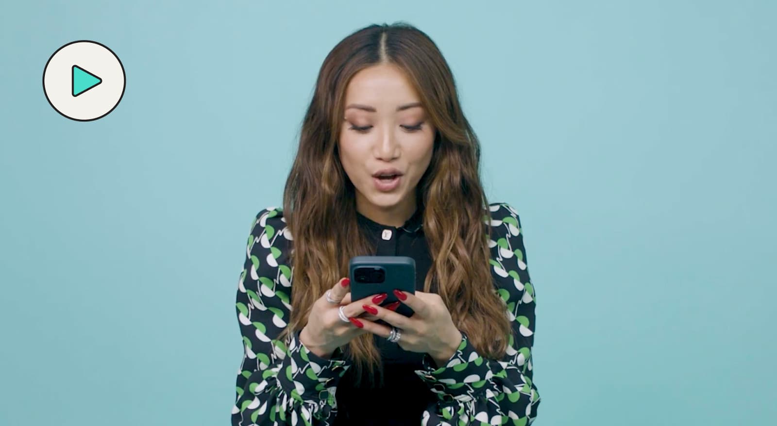 Brenda Song texting with theskimm 