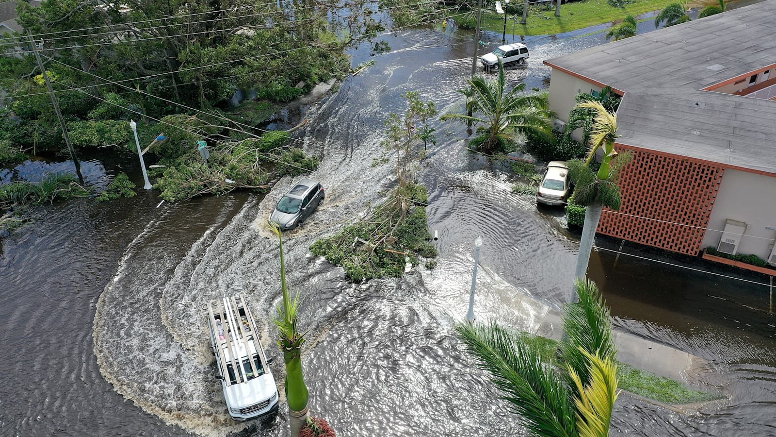 Hurricane Ian swirls cars in the road