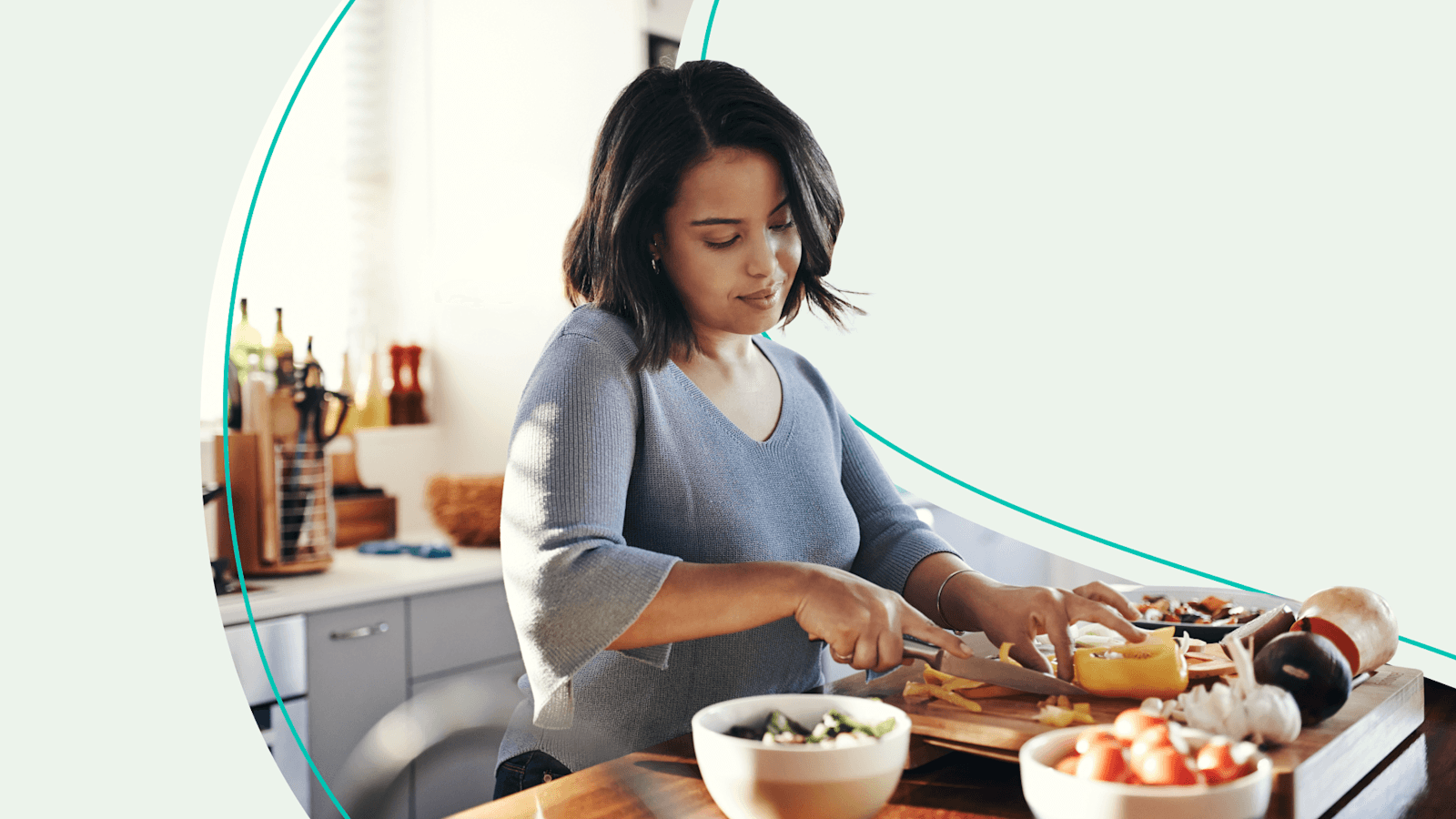 Woman chopping food in kitchen