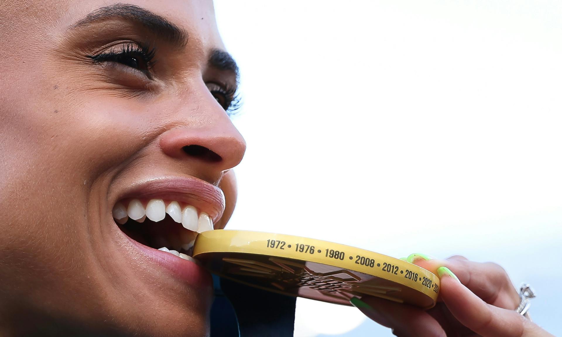 Gold medalist Sydney McLaughlin-Levrone poses with the gold medal