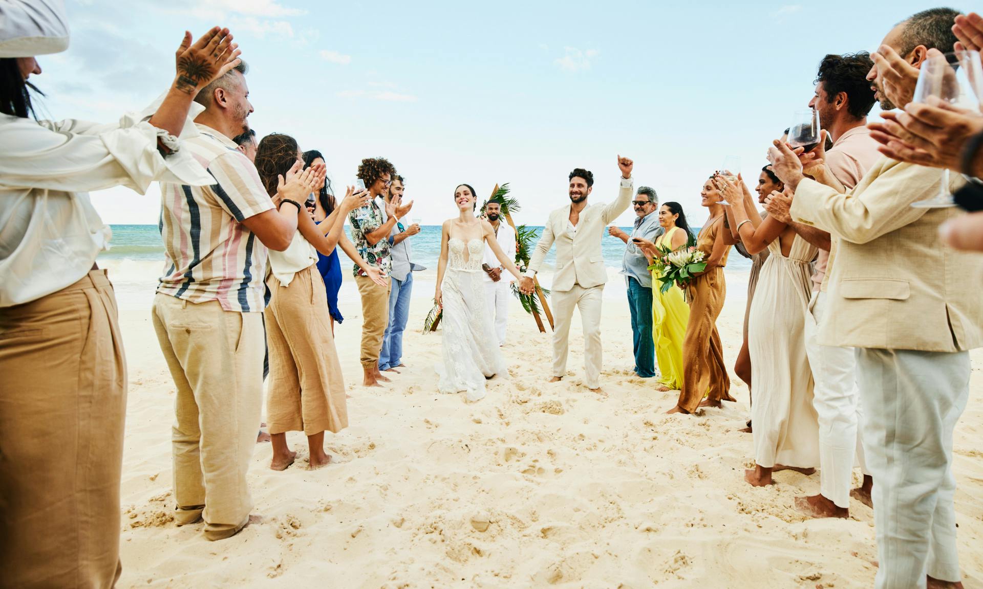 woman and man getting married on the beach