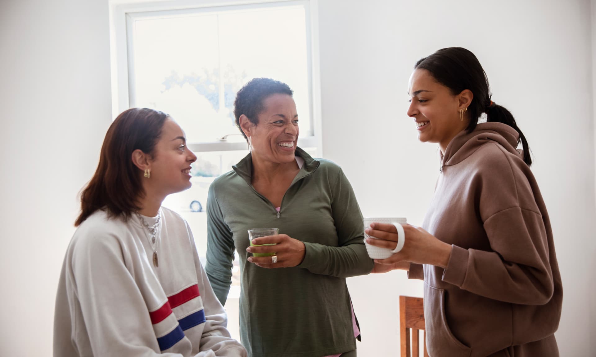 A mom and her two daughters chatting