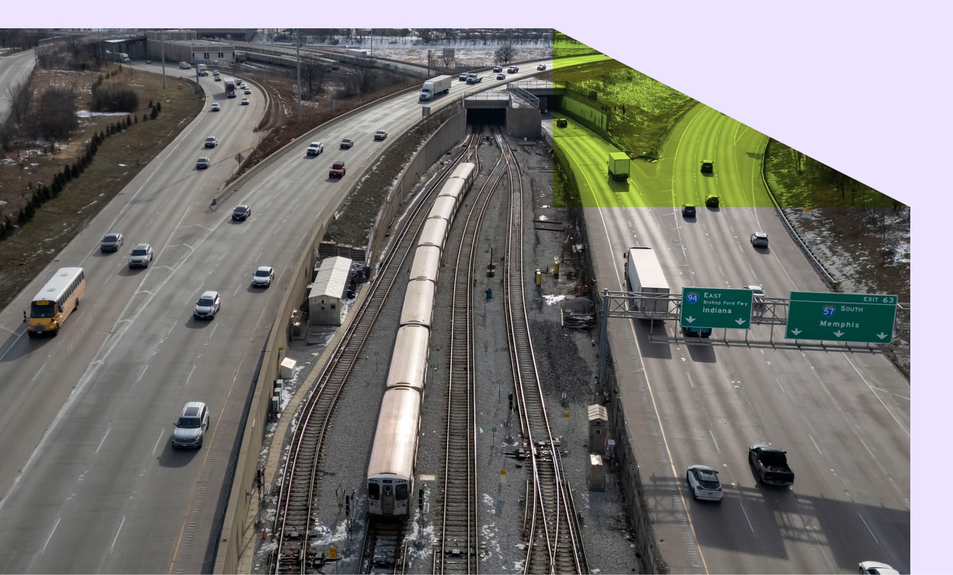 A train travels Chicago's local transit system between two freeways