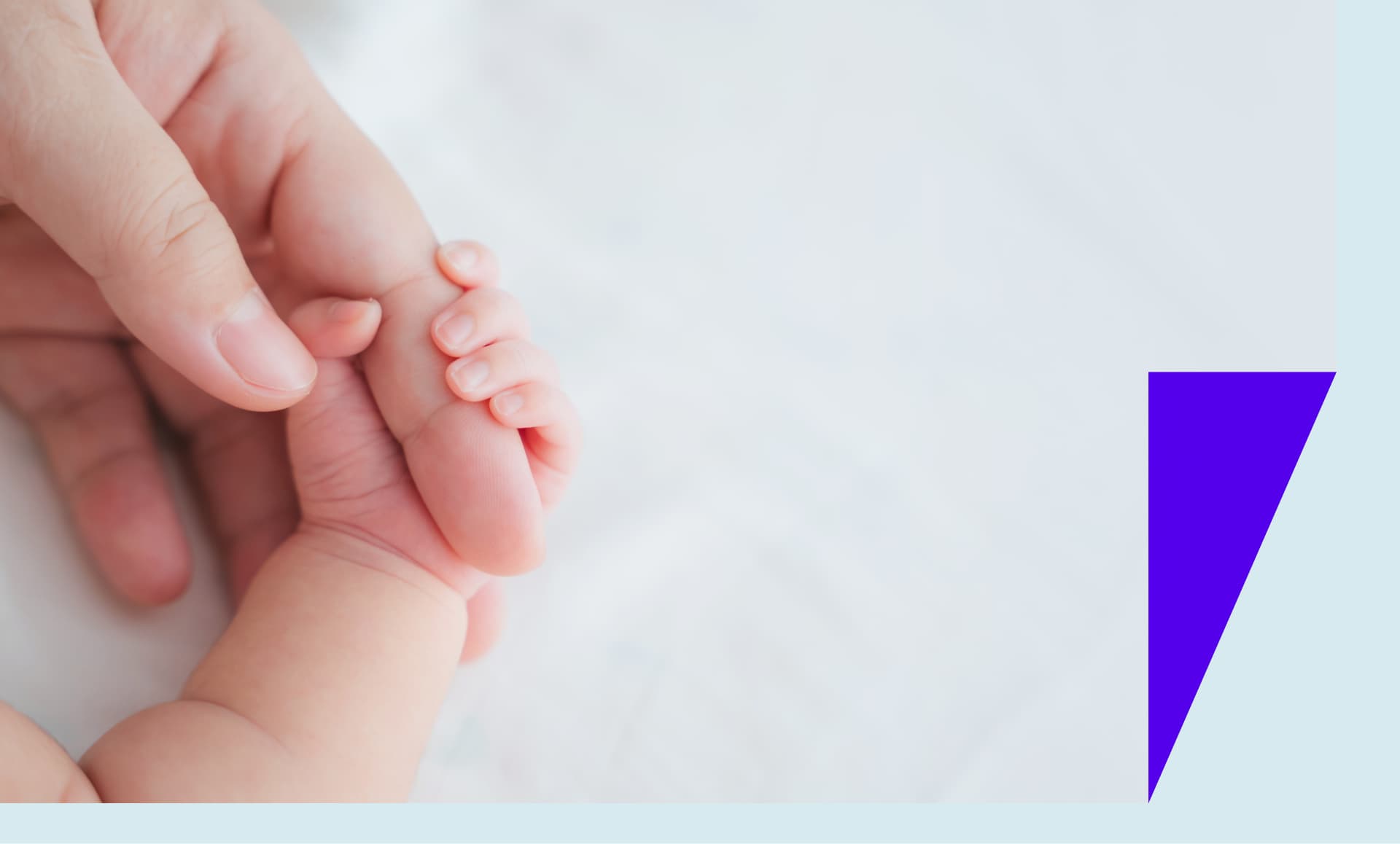 Mom holding baby hand