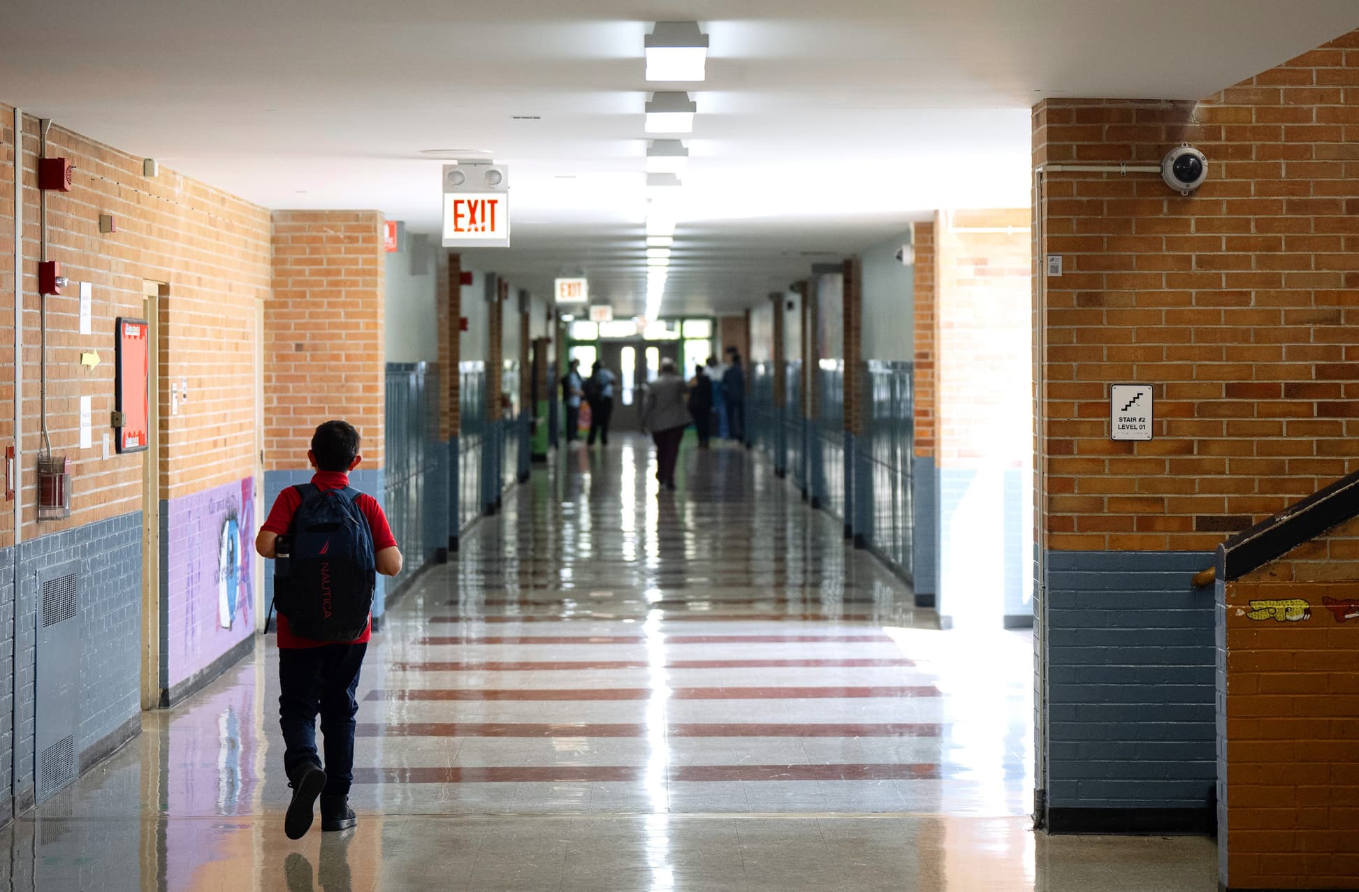 student walking through school hallway