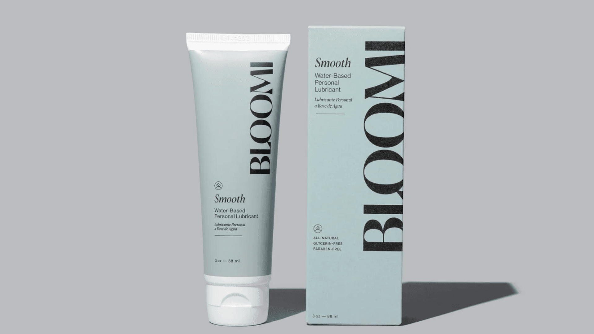 Pale blue bottle of lube with box with work "Bloomi"