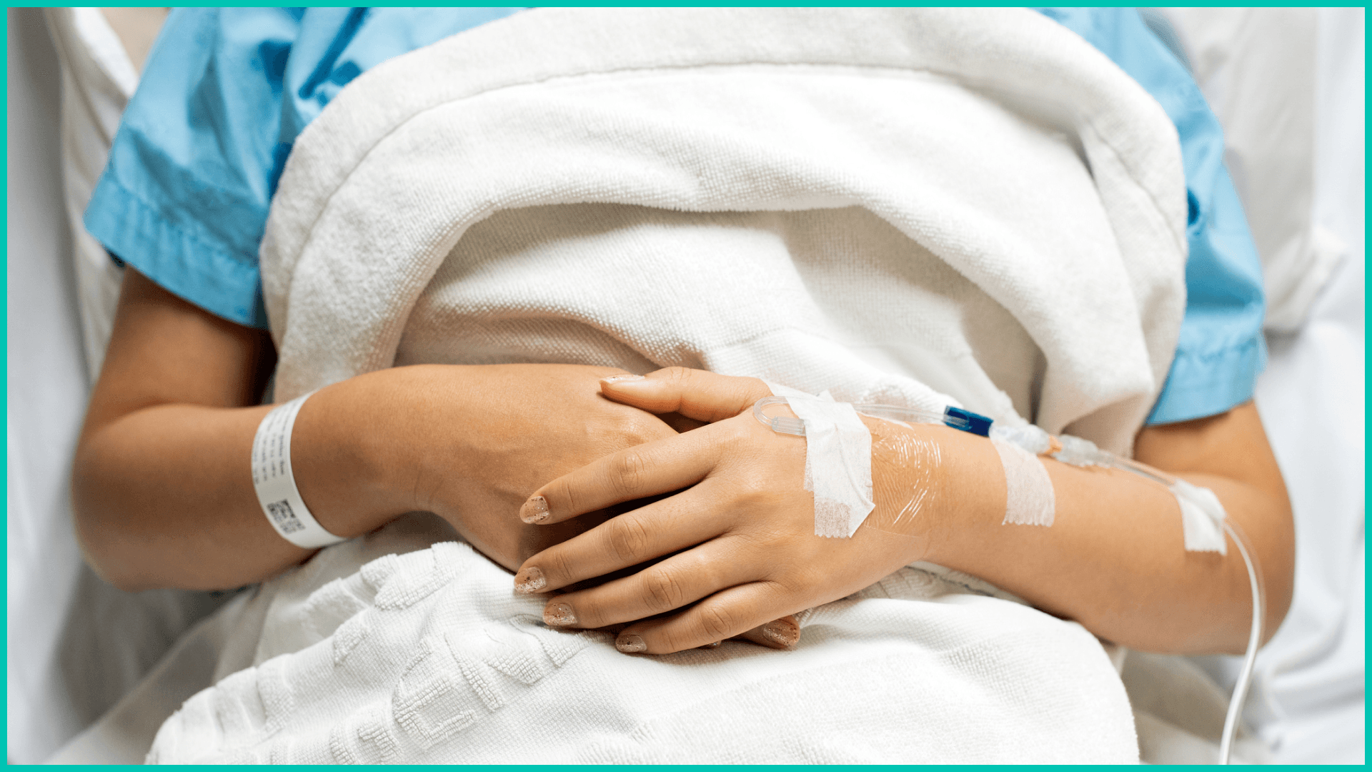 Woman receiving IV in hospital during COVID-19