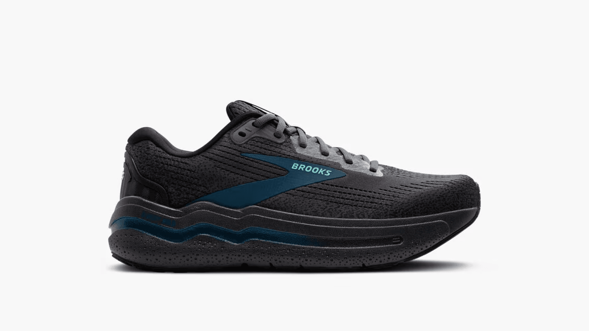 Black sneaker with blue accents and gray laces