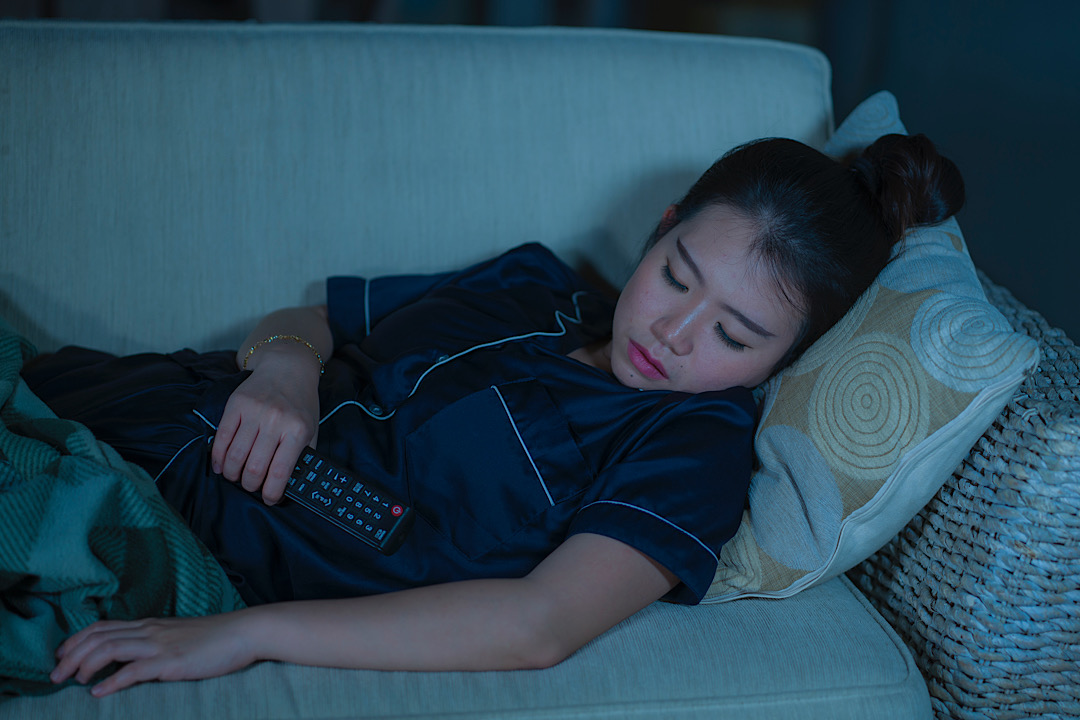 Featured image for Why You Always Fall Asleep During Movies, and 10 Ways to Stay Awake, According to Experts