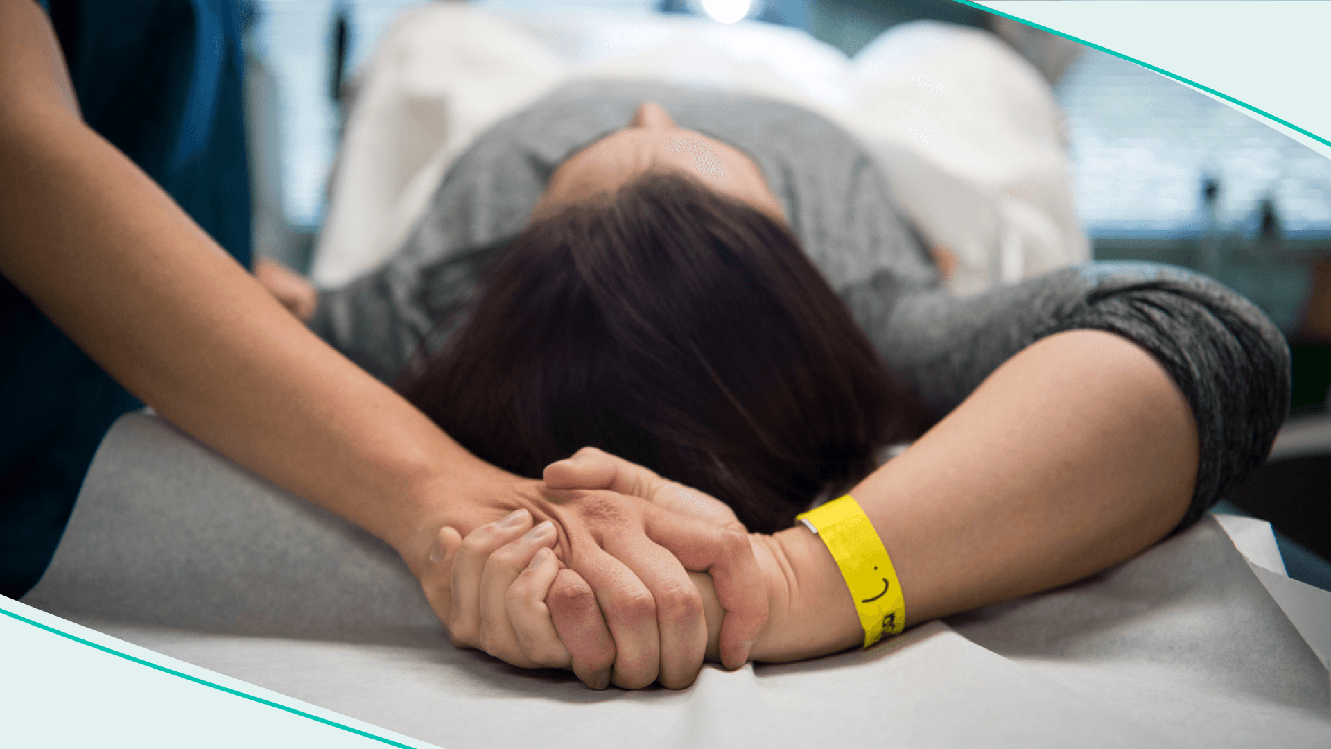 An abortion doula holds hands with a patient at an abortion clinic in Falls Church, VA