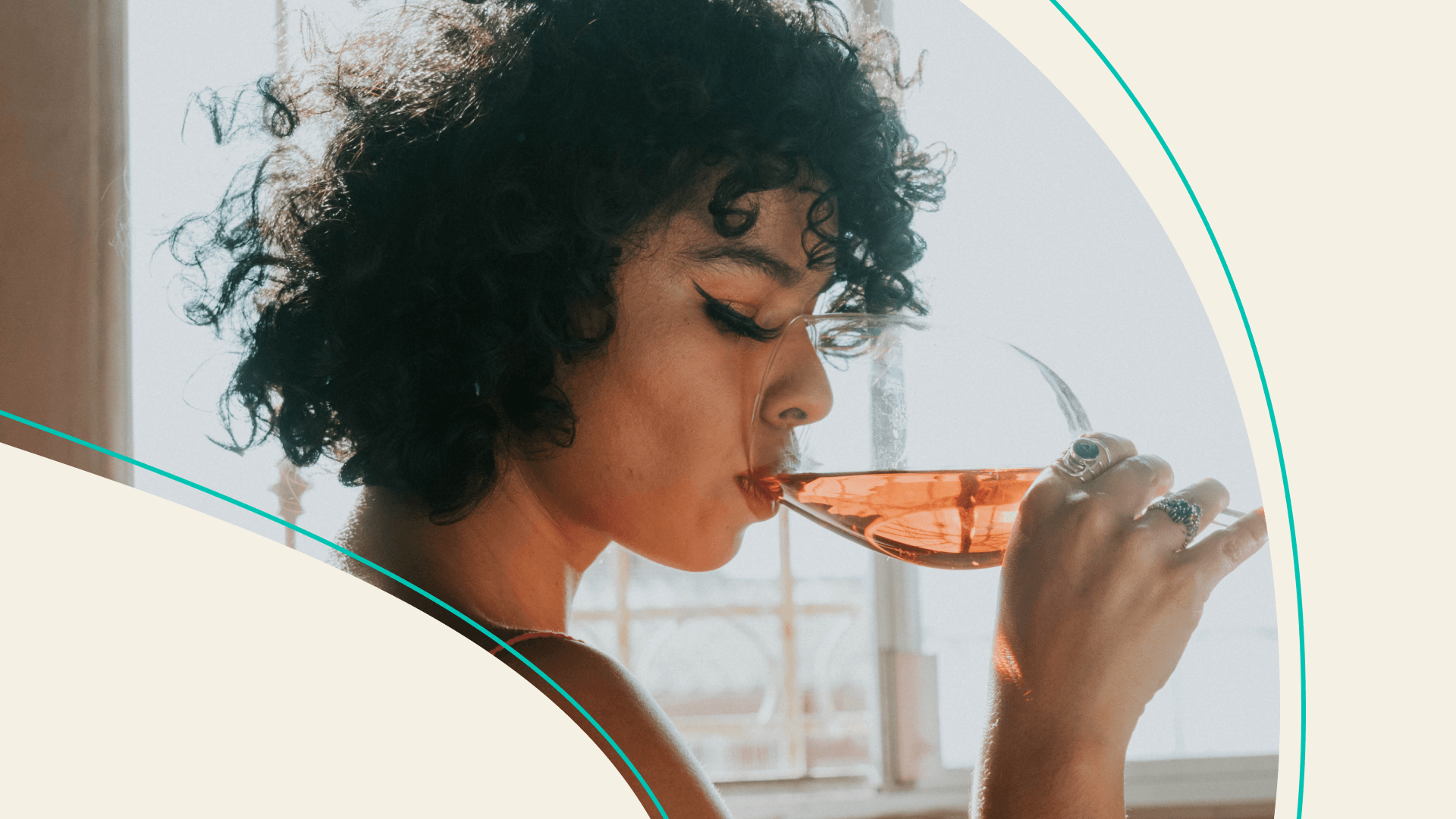 A woman drinking a glass of wine