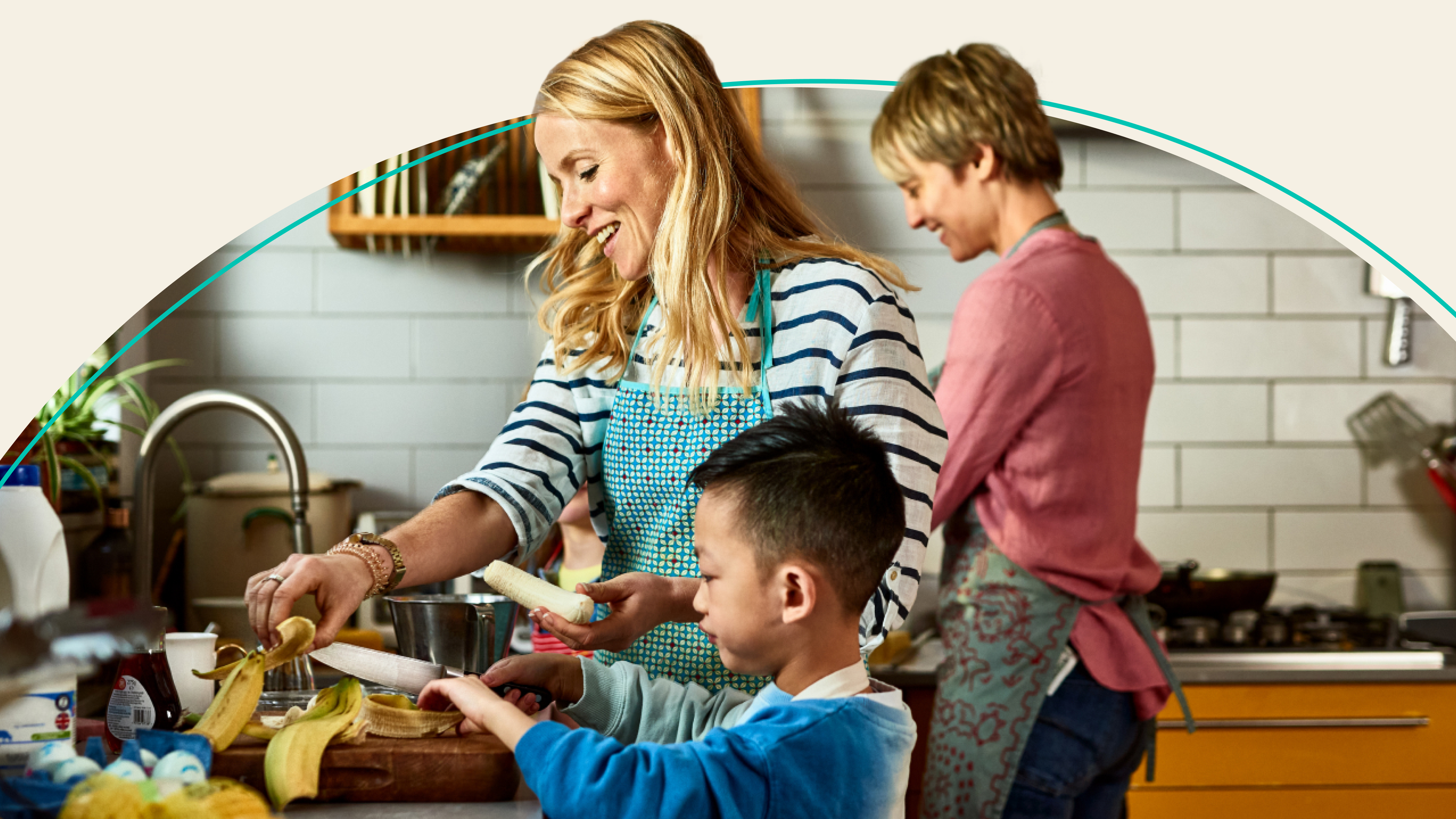 family cooking dinner in kitchen