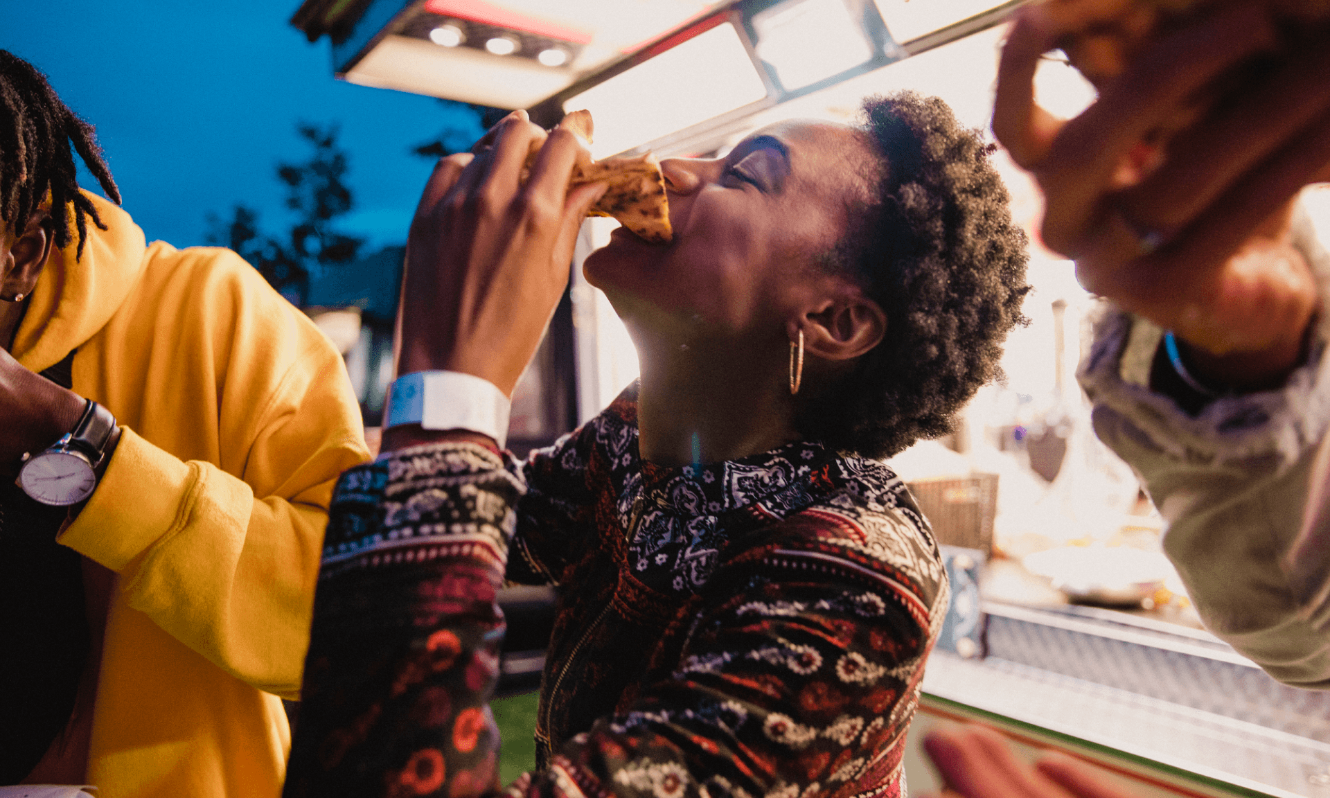 Woman eating pizza