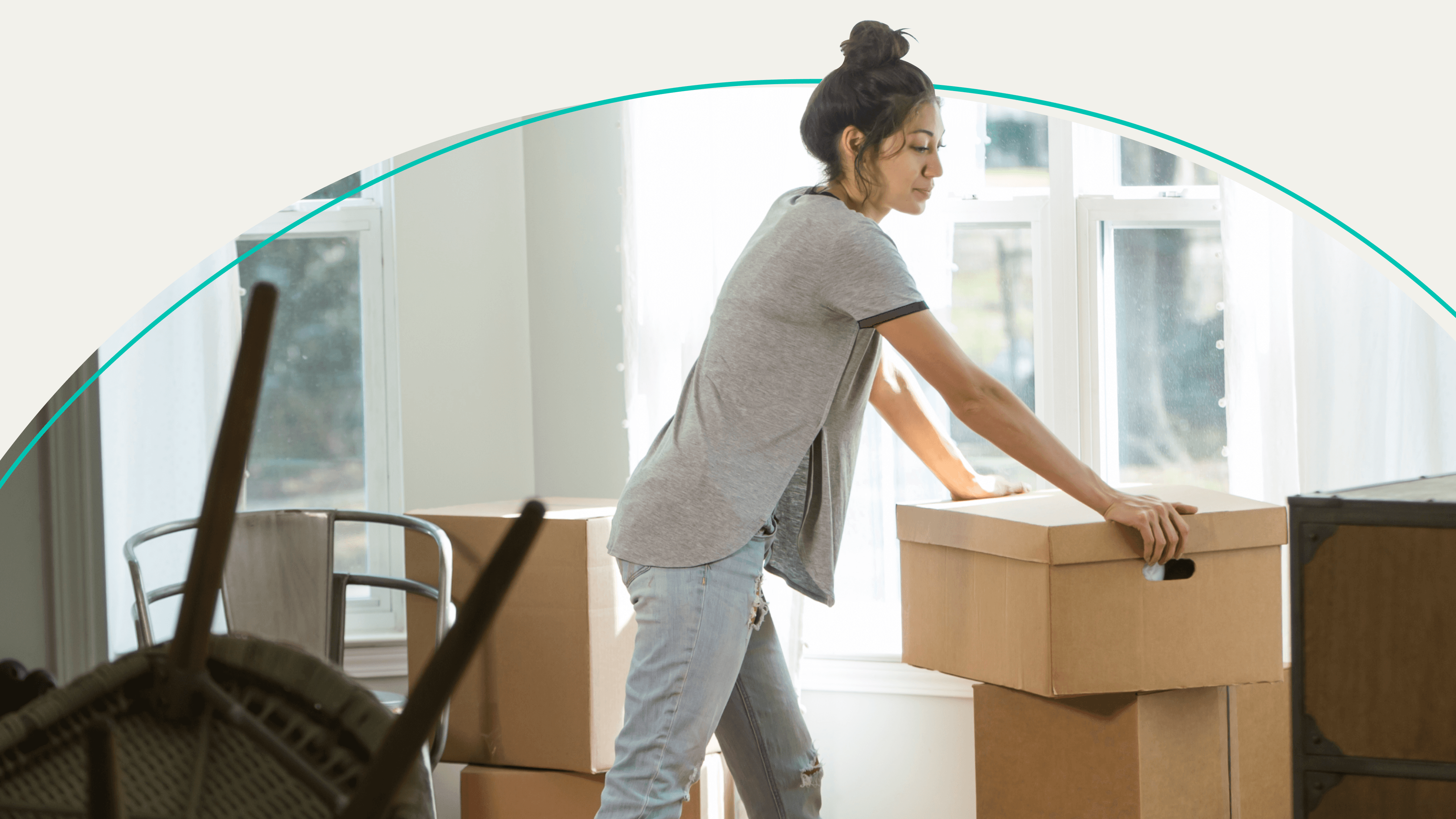 A woman stacking boxes