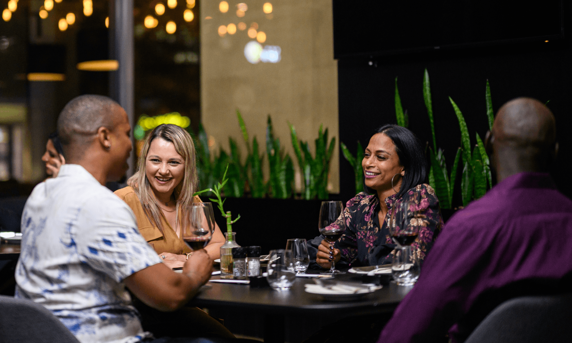 Two couples on a double date at a restaurant