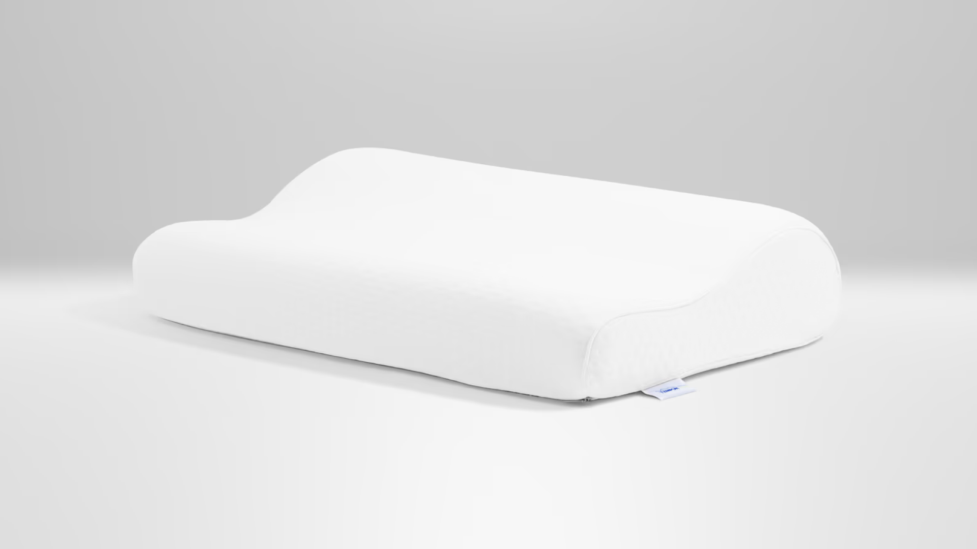 White pillow on gray background