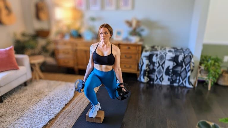 Personal trainer demonstrating front-foot-elevated lunge
