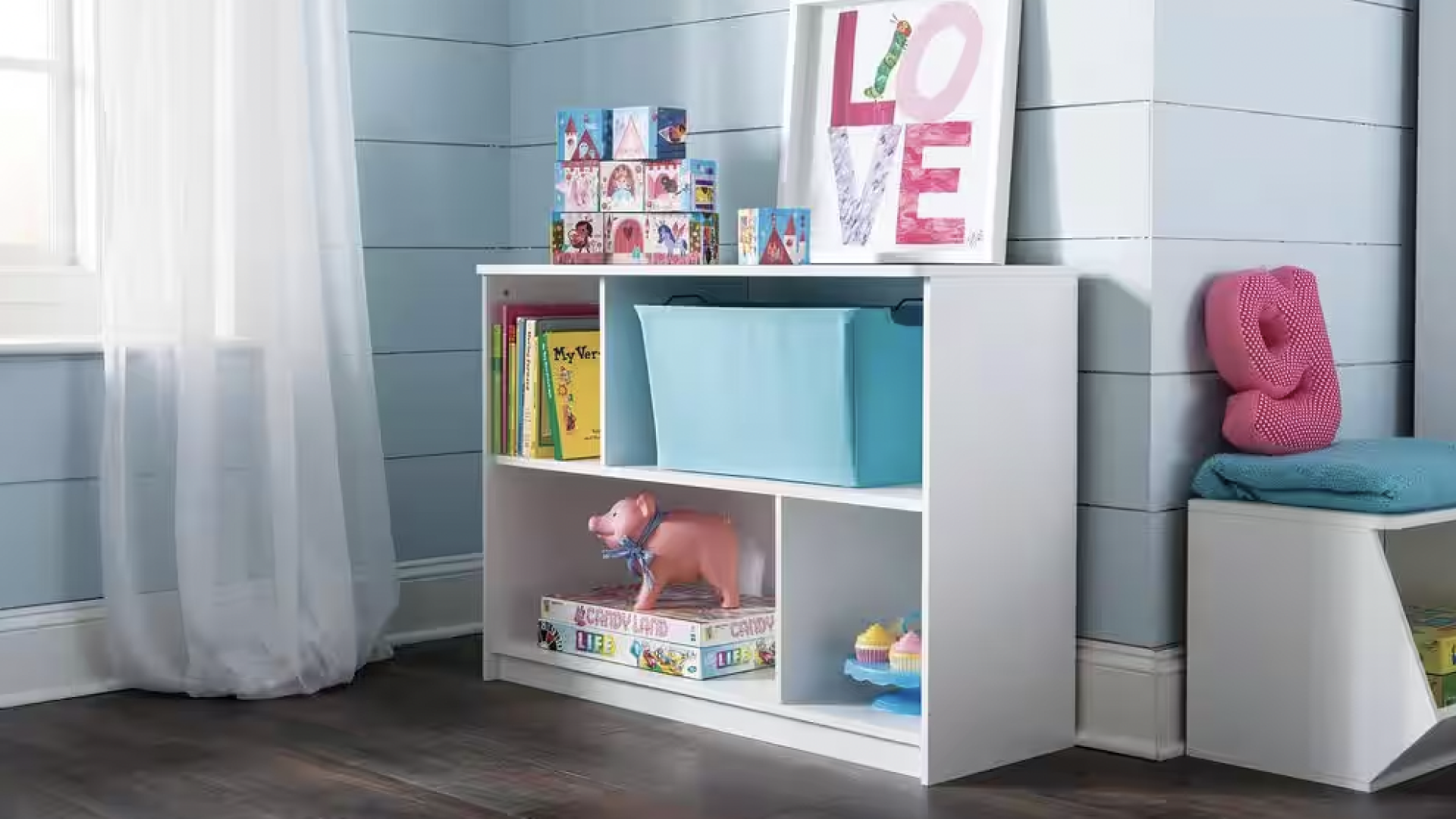 white book shelf with compartments